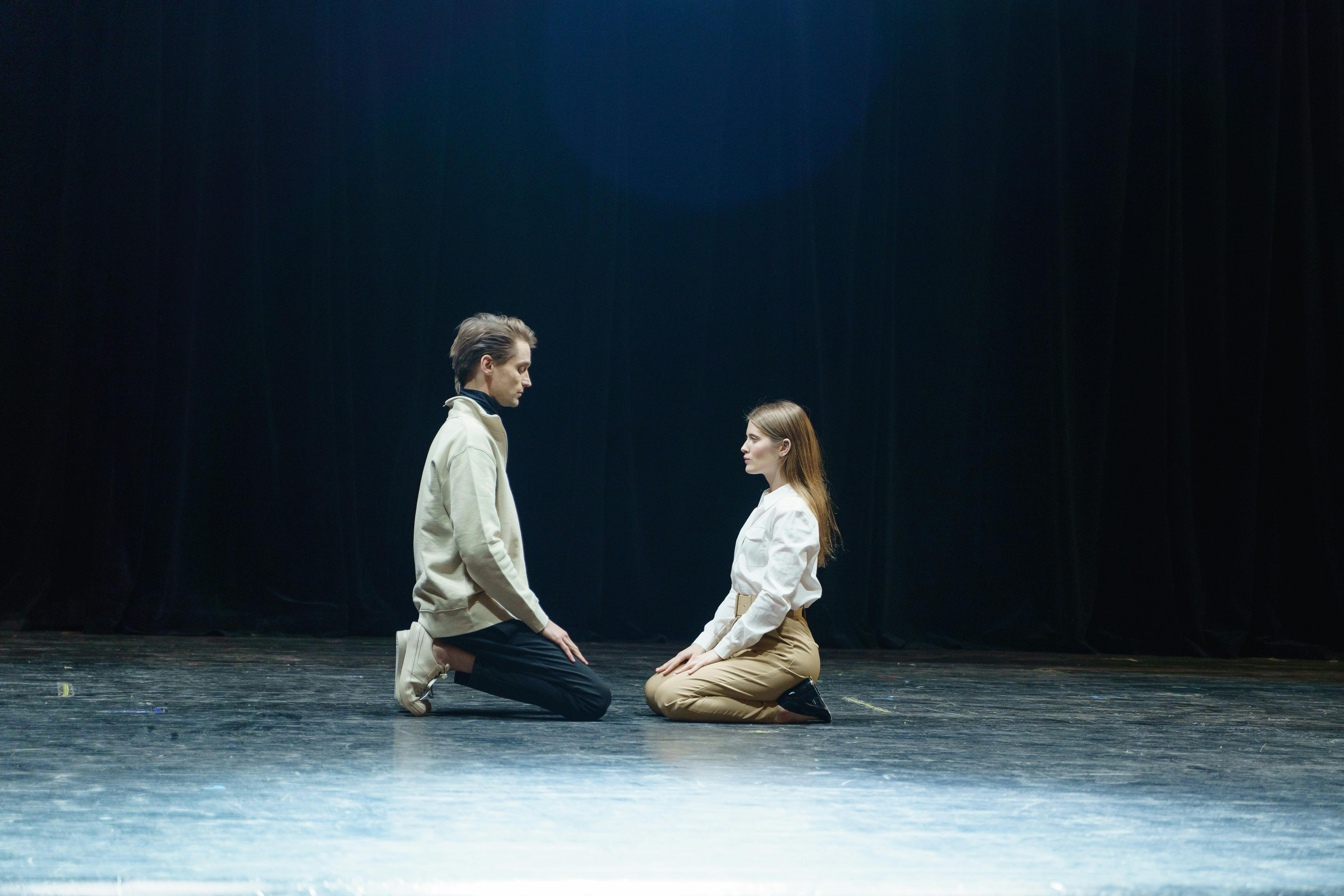 Man and Woman Sitting on Floor